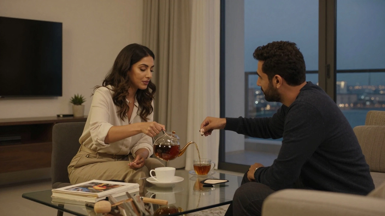 A woman and man share tea in a quiet Dubai apartment, surrounded by books and art, conveying companionship.